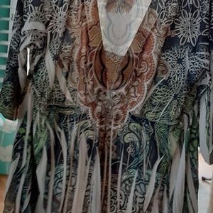 Women's top in green, cream, beige